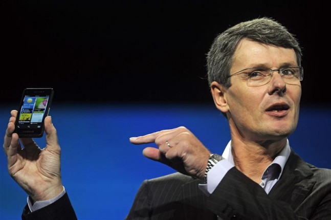 RIM CEO Heins holds up a prototype of the BlackBerry 10 smartphone at the Blackberry World event in Orlando
