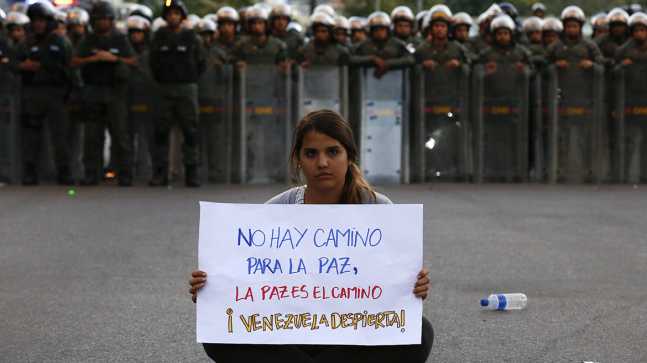 A student takes part in a protest against Nicolas Maduro's government in Caracas