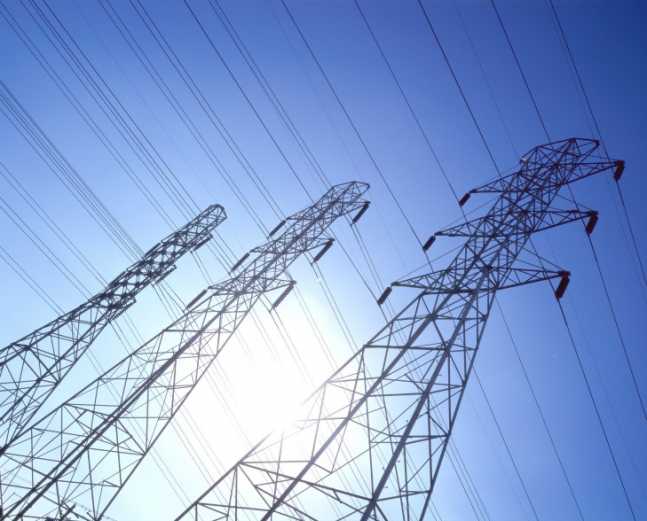 low angle view of high tension cable towers