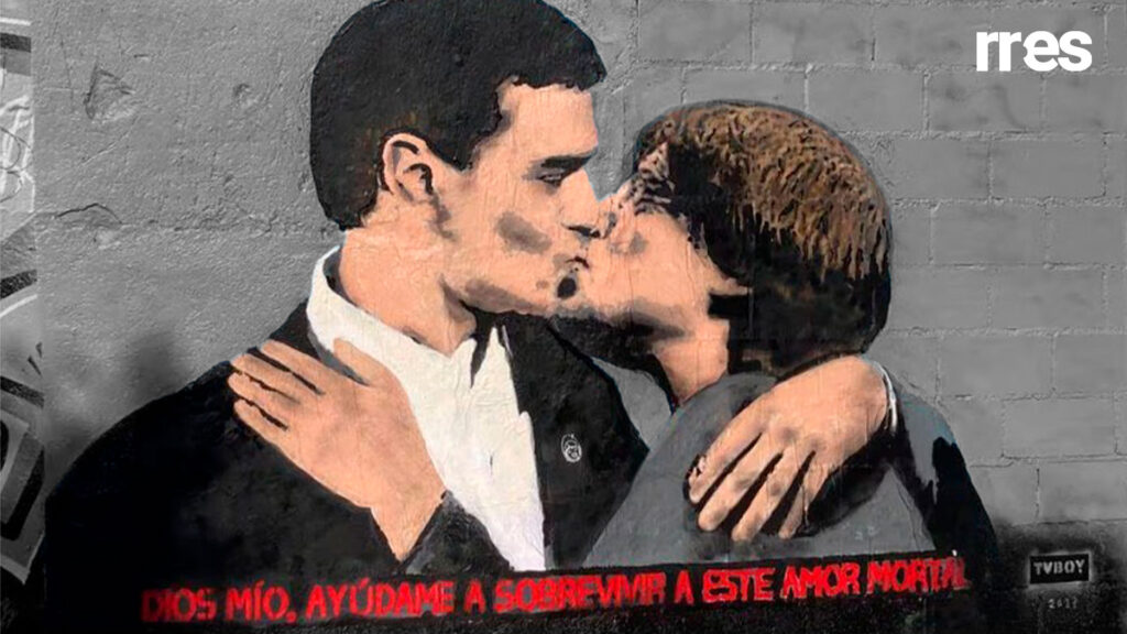 España se hunde en un profundo abismo, por Armando Martini. En la gráfica, Pedro Sánchez y Carles Puigdemont en un grafiti del artista TVboy